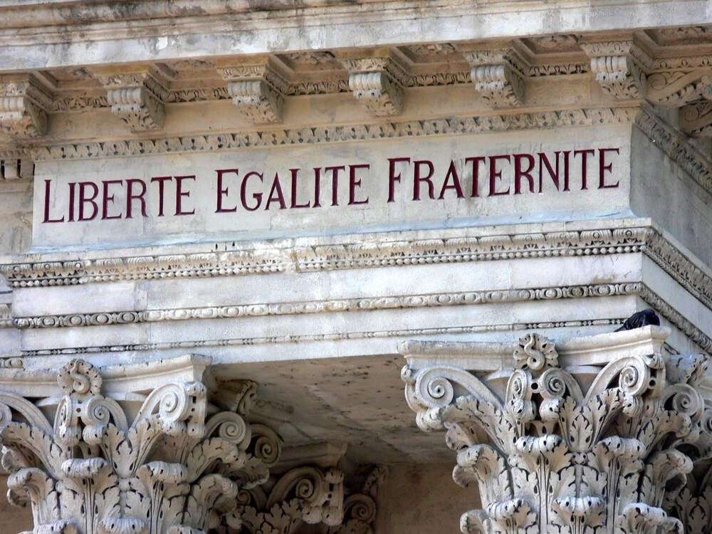 French for "liberty, equality, fraternity" is the national motto of France as seen in Avignon