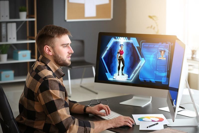 Male video games designer working in studio
