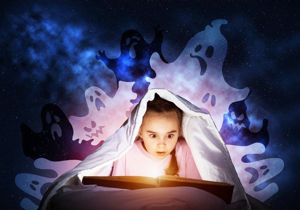 Scared little girl reading fairytales