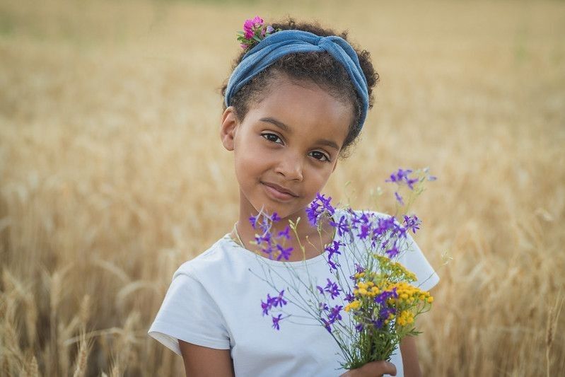 Girl holding flowers in hand