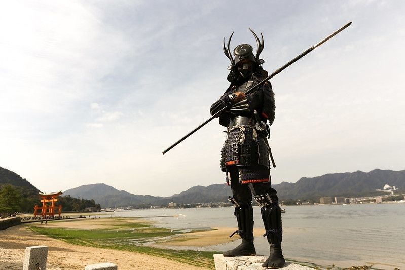 Japanese Samurai standing on the shore.