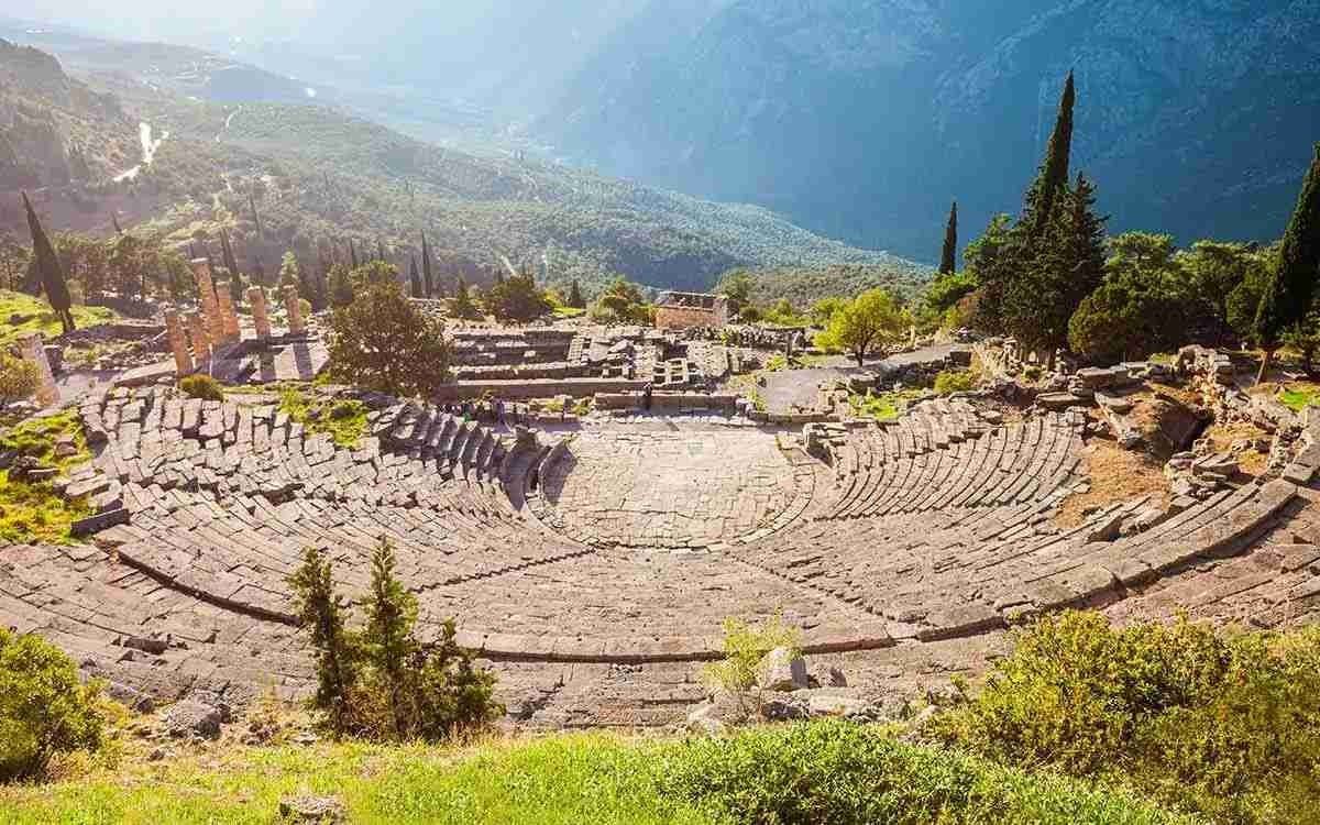 The ruins of an Ancient Greek theatre set in the mountains.