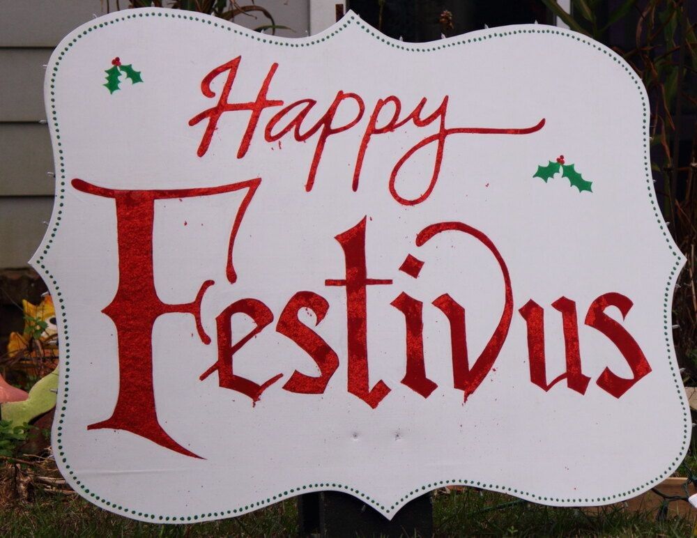 A sign showcasing the message Happy Festivus