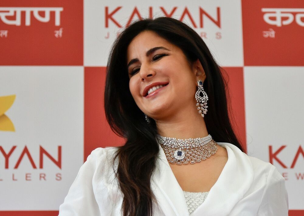 Bollywood actress Katrina Kaif speaks to her fans as she attends the opening ceremony of Kalyan jewellers