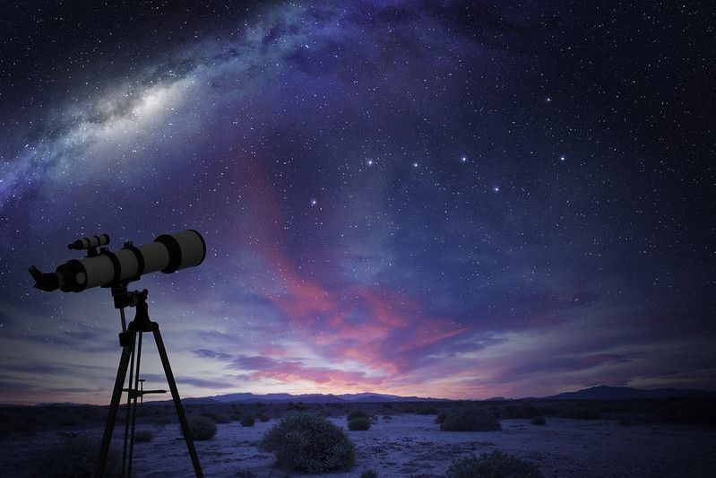 Telescope in the desert watching the Great Bear constellation and the milky way.