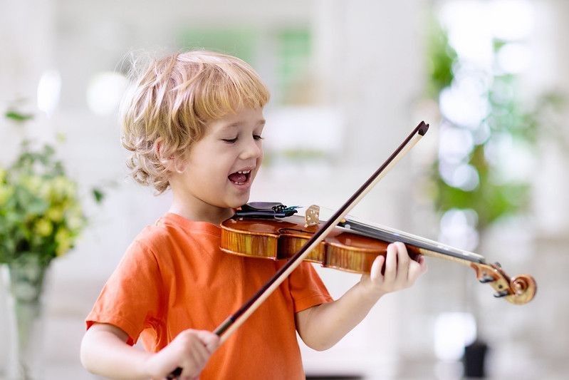 Little boy with musical instrument