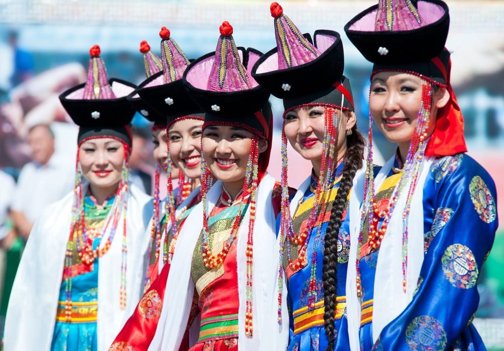 Unidentified women dancers wait for their performance at the 4th General Session of the World Mongolians Convention.