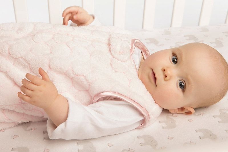 Safe Sleep Environment for Baby in Cozy Pink Puff Sleeping Sack.