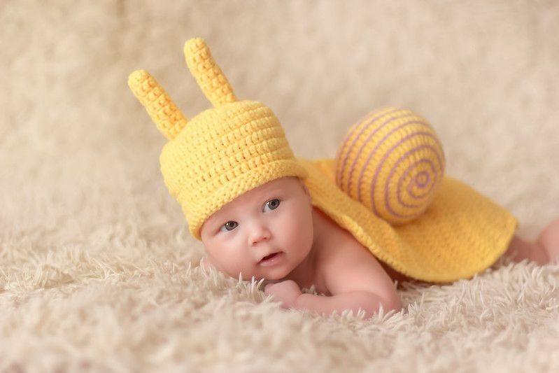 Newborn baby Joshua in knitted snail costume - Nicknames