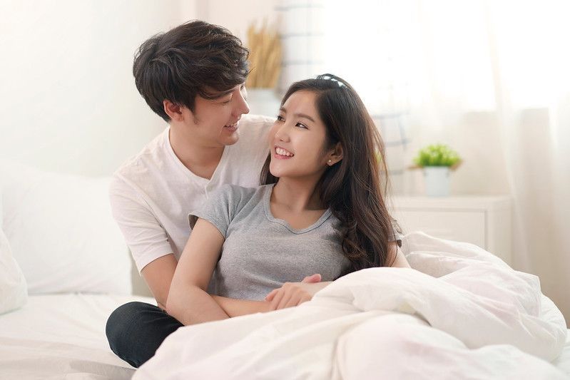 Asian young couple man and woman staying together
