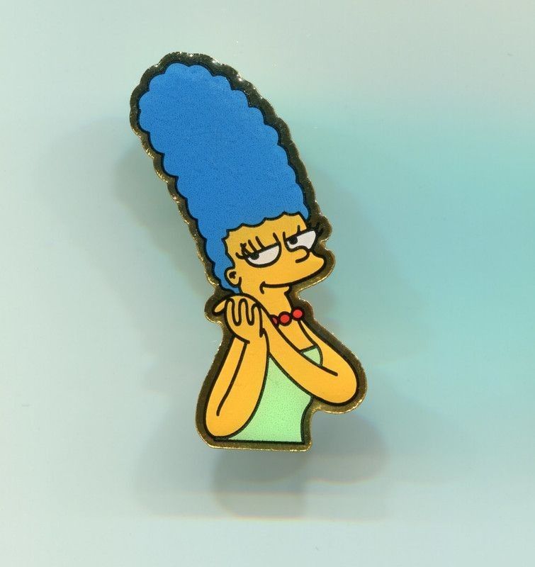 Marge Simpson pin on blue background