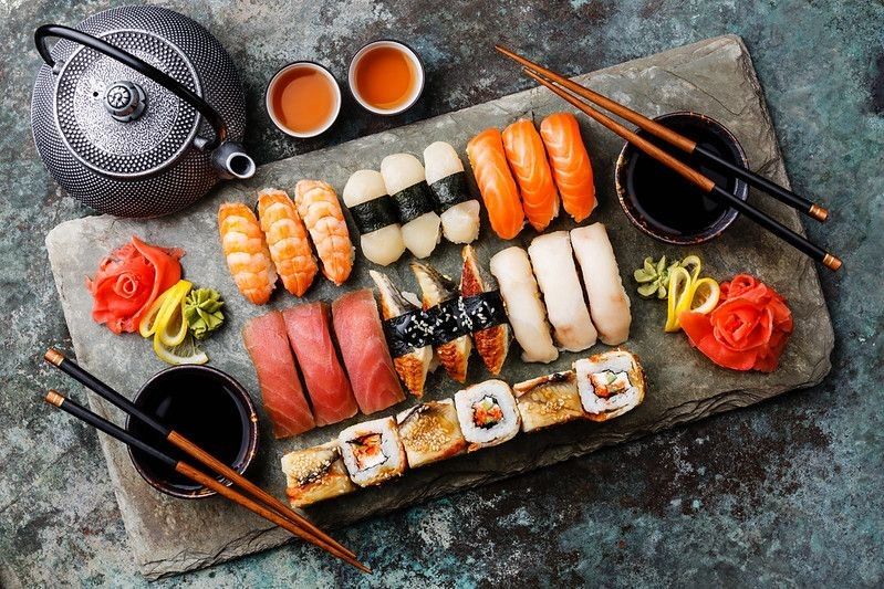 Sushi Set nigiri and sushi rolls with tea.