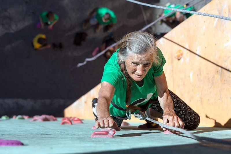 Aged Woman Climbing Wall Elderly Female