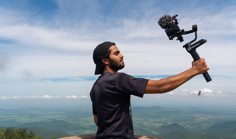 A travel vlogger shooting at higher altitudes