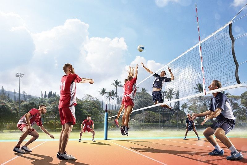 Players playing volleyball in outdoor.