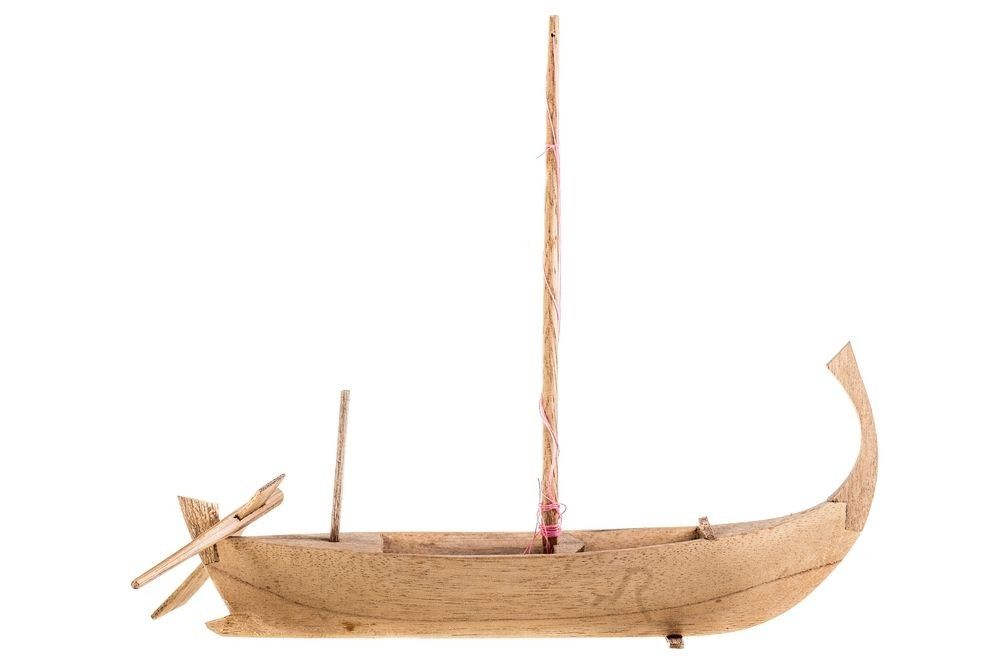 A wooden egyptian boat model isolated over a white background.