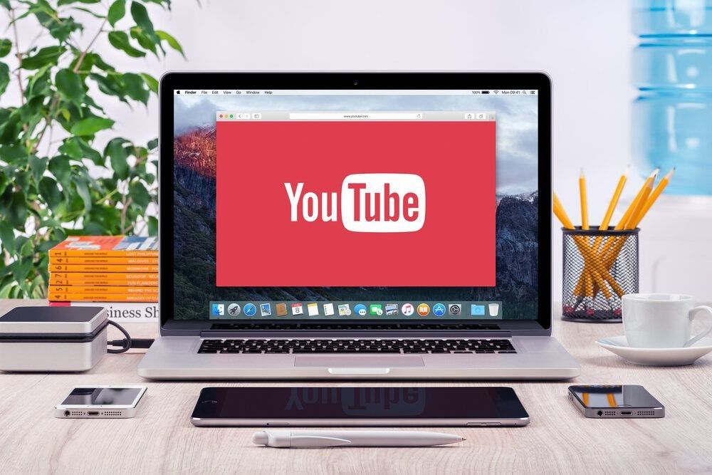 YouTube logo on the front view Apple MacBook Pro screen